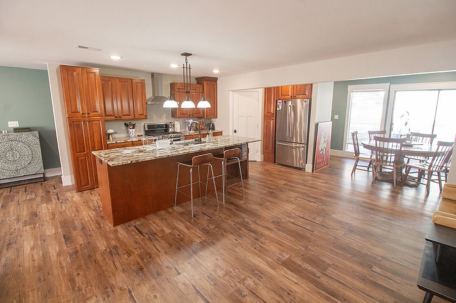 The breakfast table sets tucked into this sunny alcove with a great view of the yard and deck.