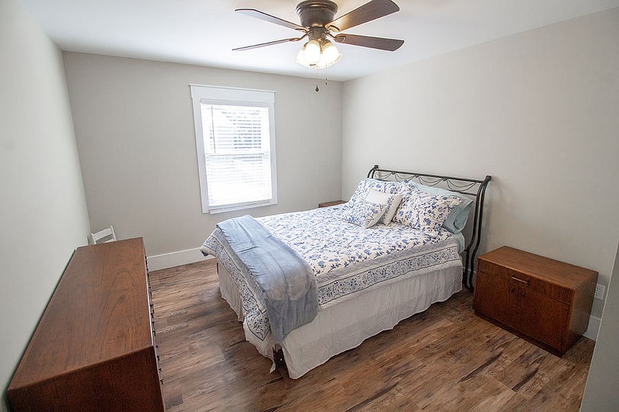 Another bedroom w/a queen bed across from the primary bedroom