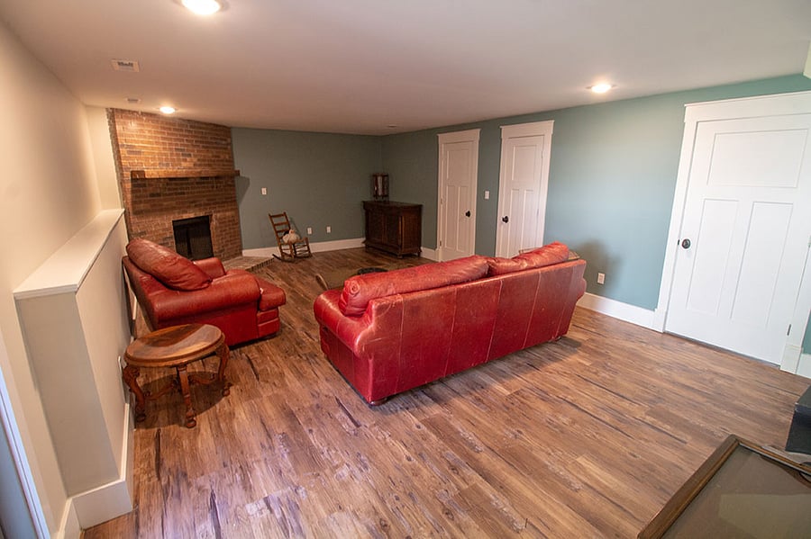 Theres a nice big family room down with a big d comfy couch.