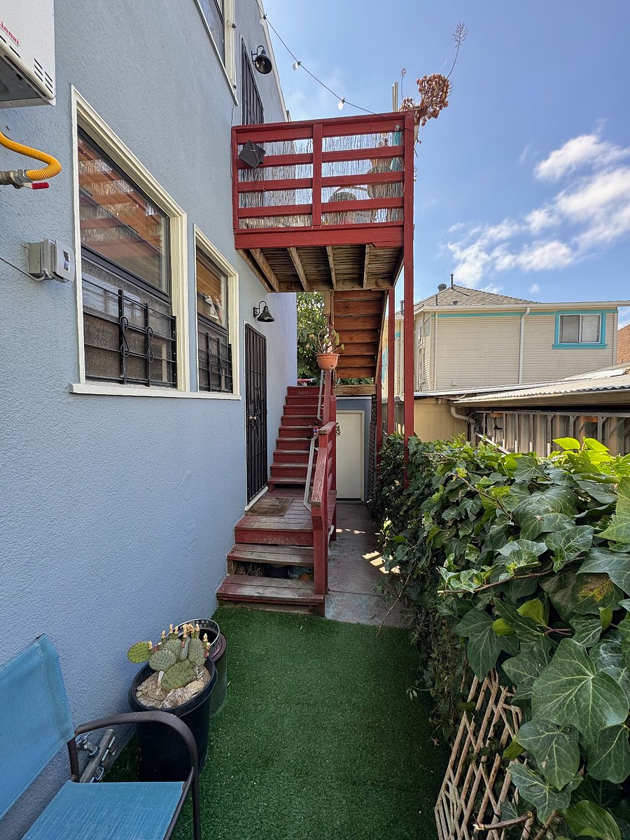 back yard, back door from kitchen to the left, door to garage/laundry is back to the right