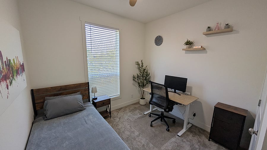 3rd Bedroom with twin bed instead of chair. Bed is designed higher to store suitcases under.