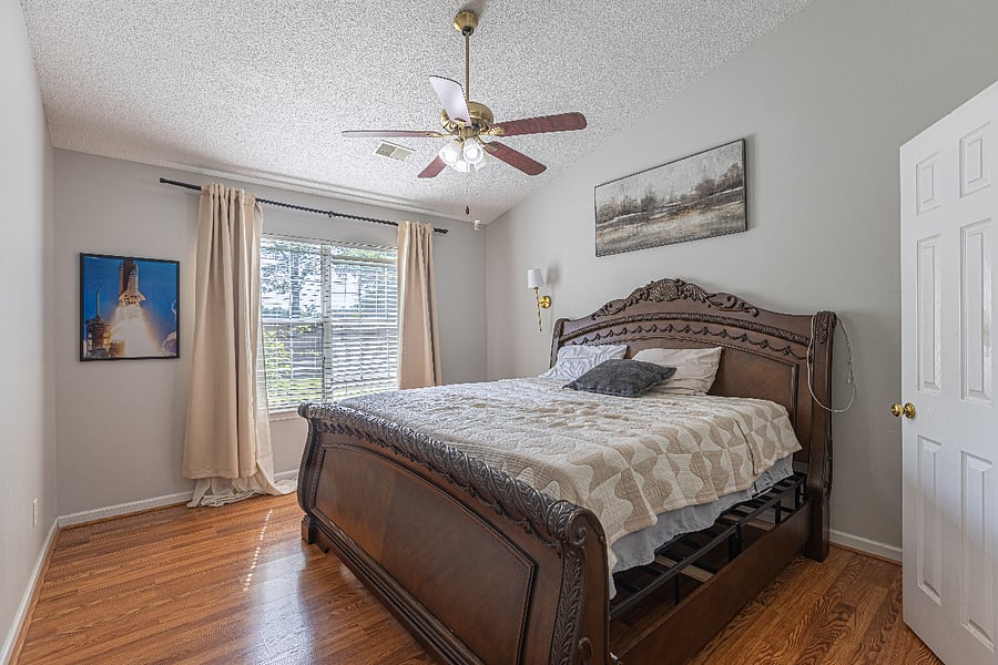 Spacious primary bedroom with king bed, large closet