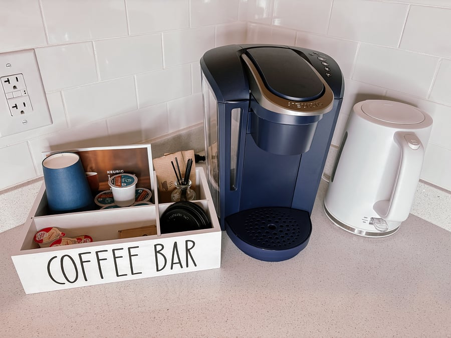 Cozy Coffee Corner Includes Keurig Coffee Maker (as well as a regular drip coffee machine kept in the cabinet) and Electric Kettle + Starter Coffees