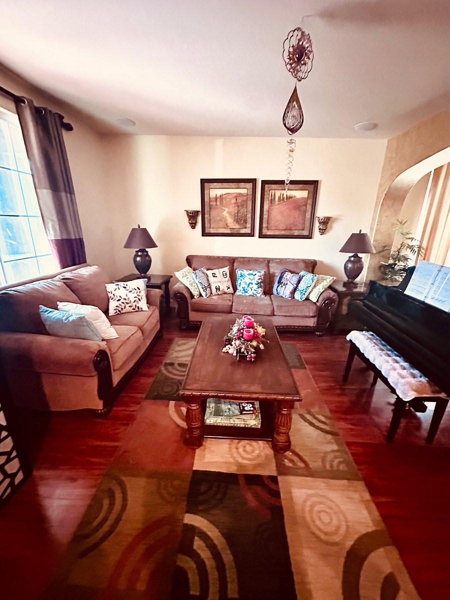 Formal living room with Yamaha baby grand piano .