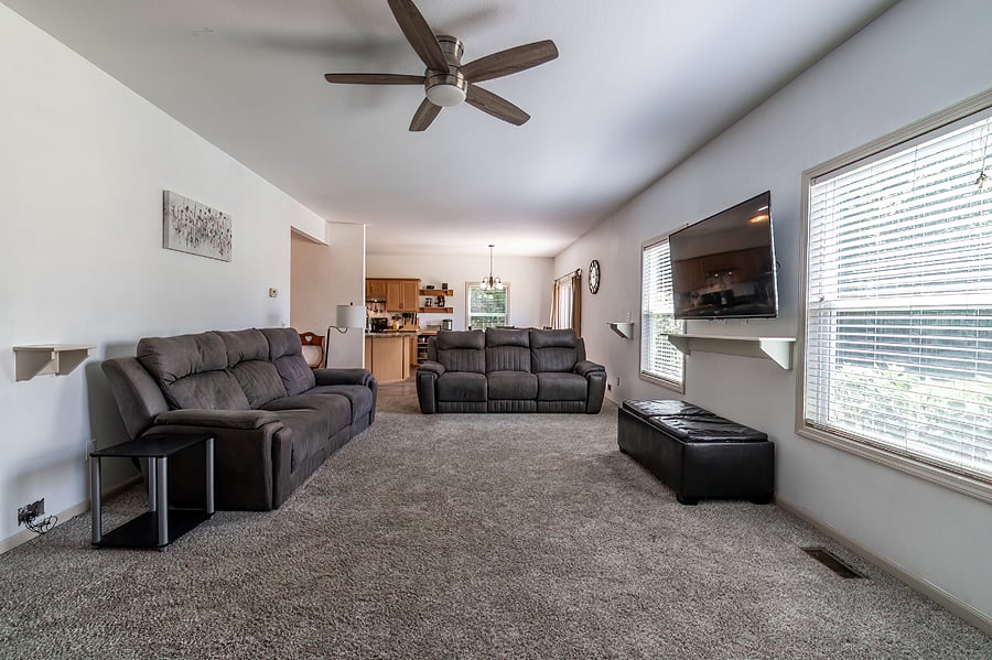 Living room with TV, 2 couches with So Cozi massagers and fireplace