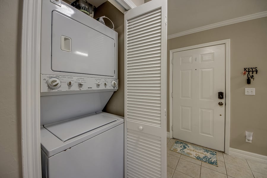 Laundry closet off of kitchen.