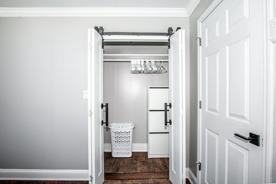 spacious closet with barn doors