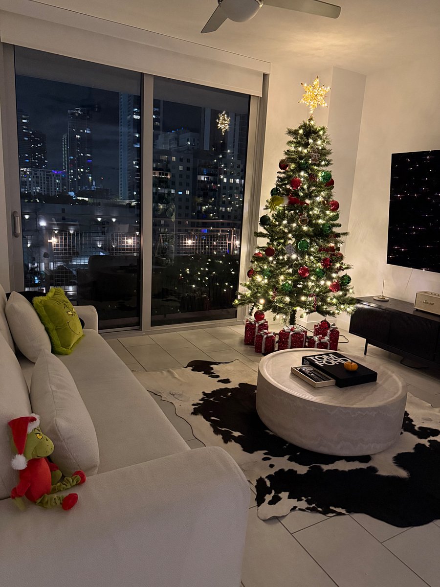Bright and cozy living room with a warm holiday vibe. Enjoy the city lights, soft decor, and a relaxing space that feels just like home for the festive season.