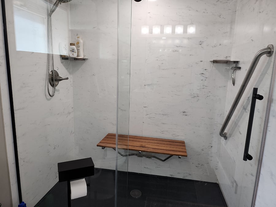 6' x 3' walk-in or roll-in shower. Has 3' teak bench that lifts up for storage.  