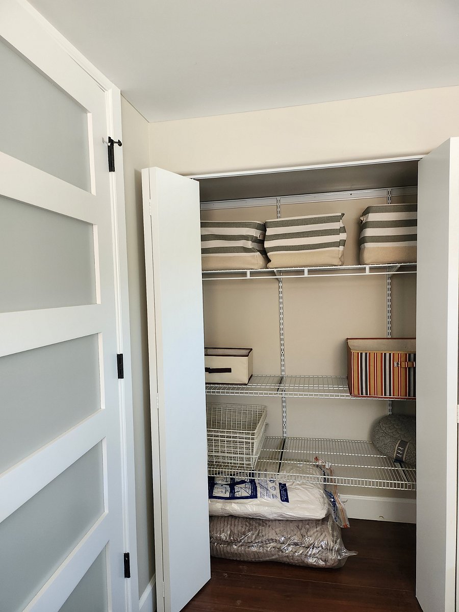4 ft closet with adjustable shelves and storage bins.