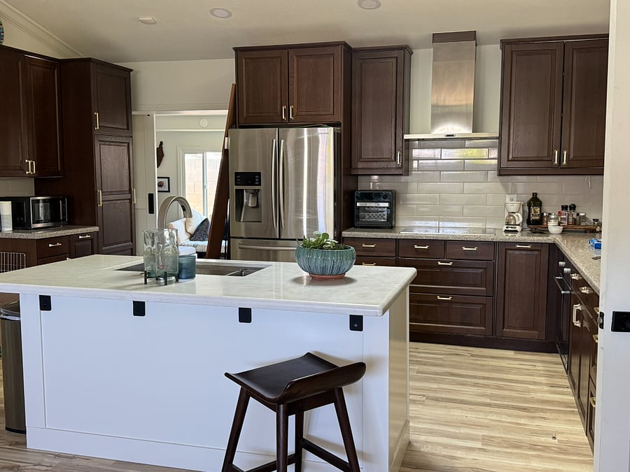 Granite countertops. Kitchen island and pantry in kitchen and laundry for storage. Large Kitchenaid blender along with refrigerator, oven, stove, microwave and dishwasher. 