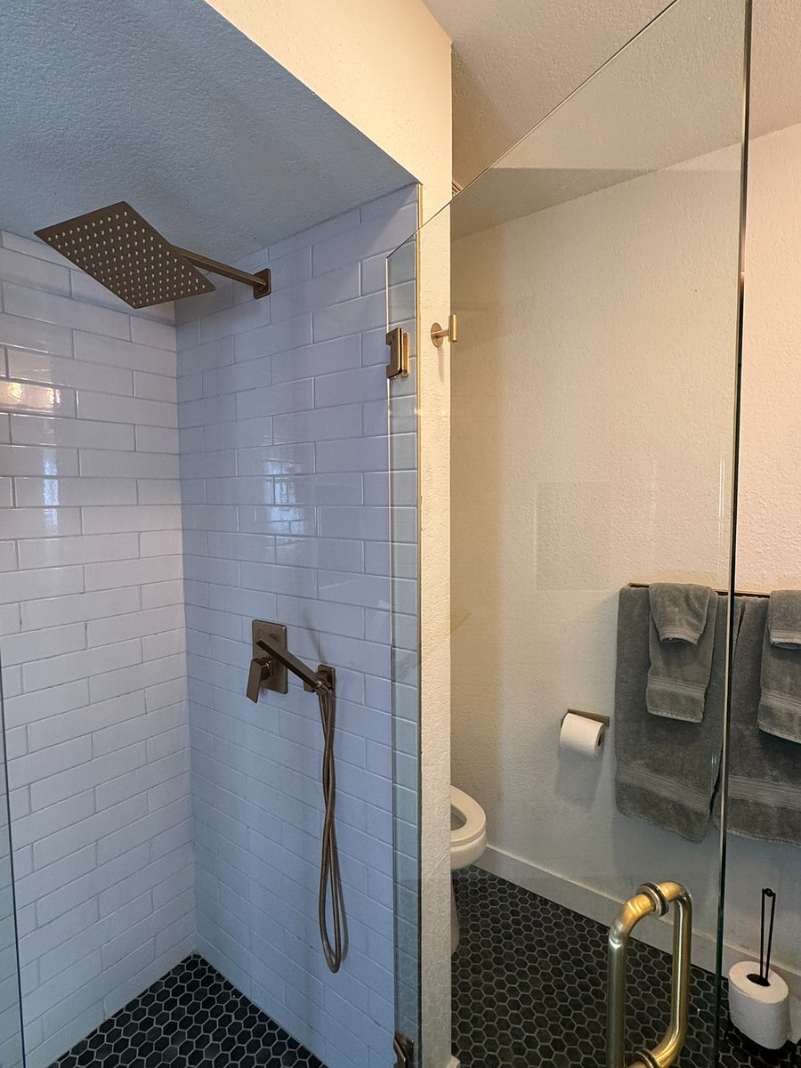 Primary bedroom rainfall shower and hand held nozzle too!