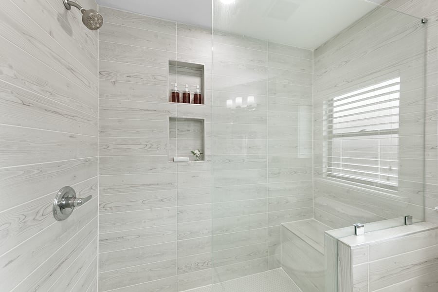 Spacious shower with bench seating.