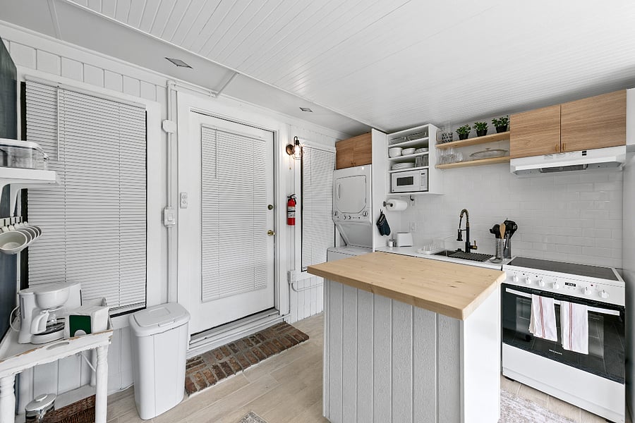 Laundry center, dishwasher, food disposal, stove, microwave and spacious fridge with ice maker. Island for food prep.