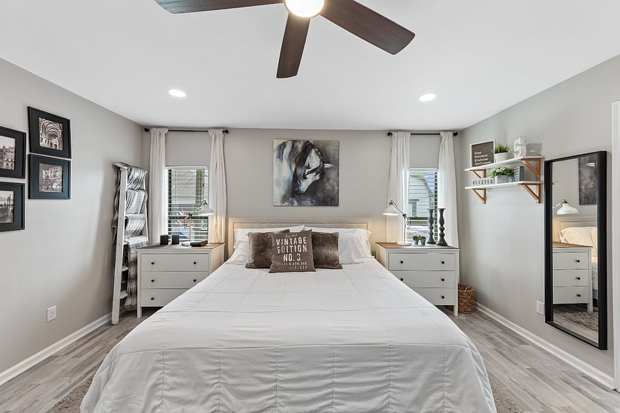 Wardrobes on both sides of bed. Full length mirror.