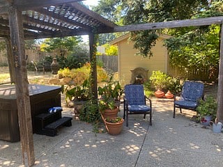 Backyard, hot tub and water fountain.