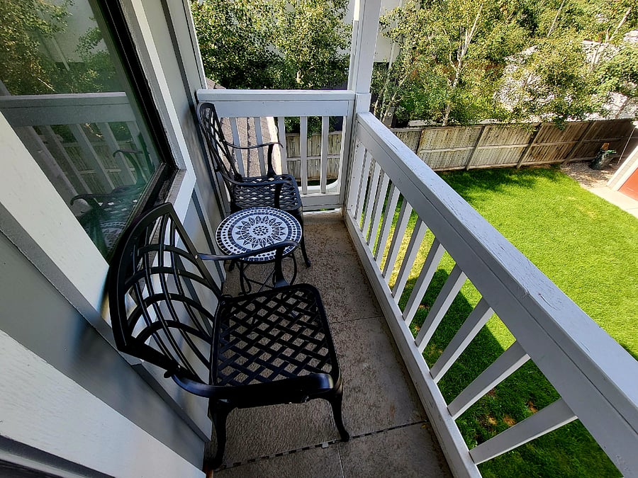 small patio with table and chairs