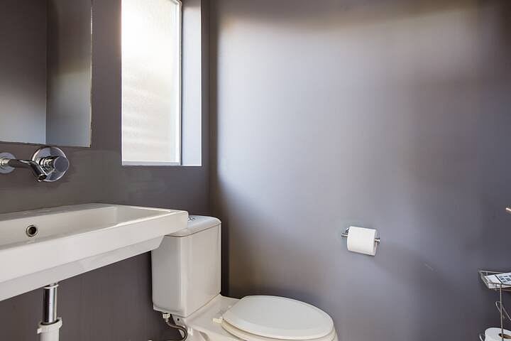 Bathroom 3 (first floor): half bath just inside the front door