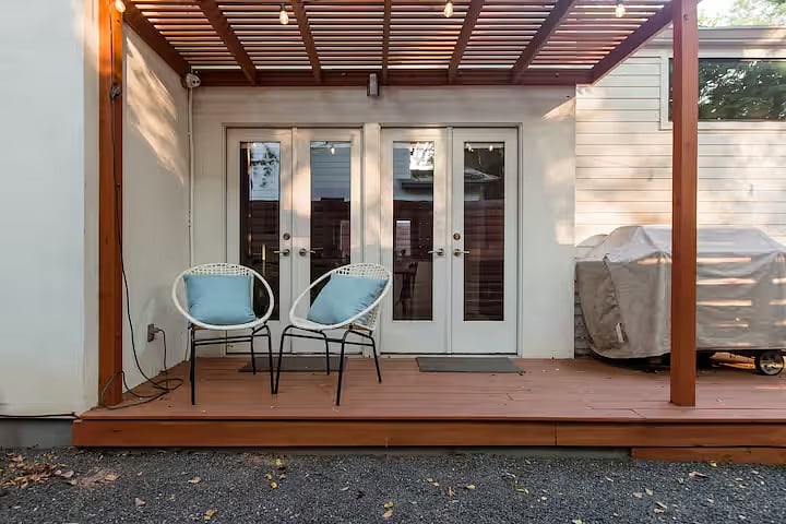 View of the side deck and pergola (that's the dining room inside). That's the four-burner Weber Genesis II E-410 Natural Gas Grill.