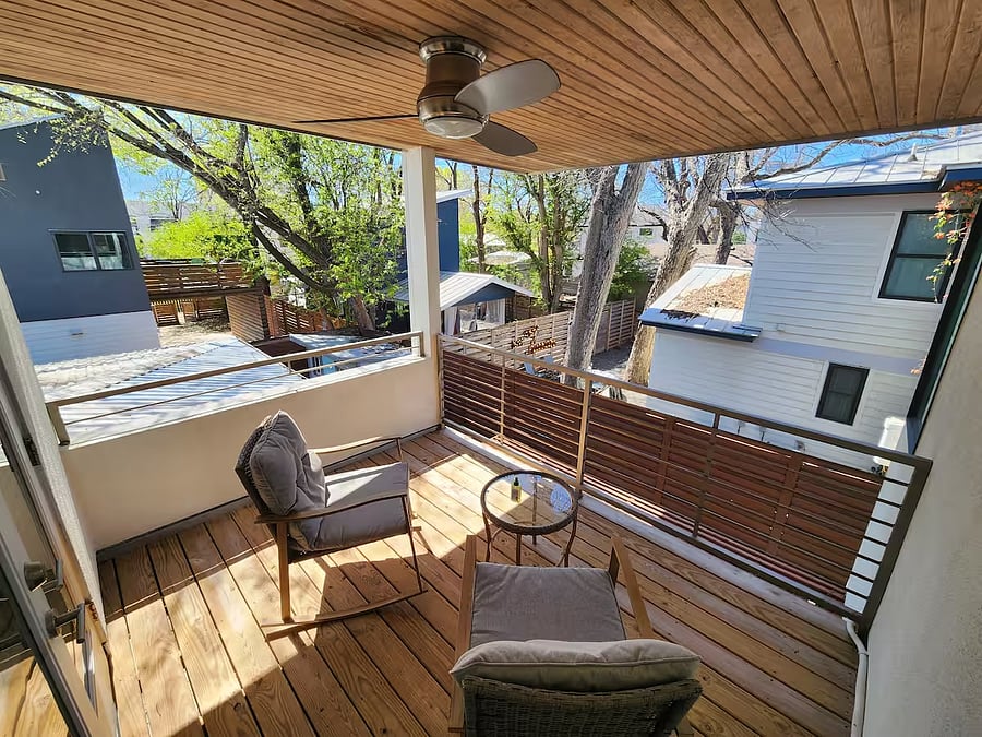 Balcony accessible from the upstairs bedroom w/ view of the backyard