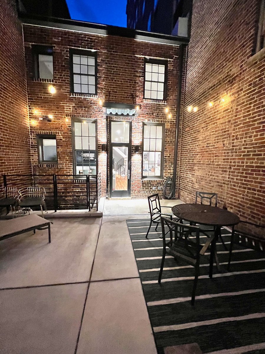 You will love spending evenings on your private patio. Party lights strung wall-to-wall, plus beautiful sconces that wash the historic brick walls with light.