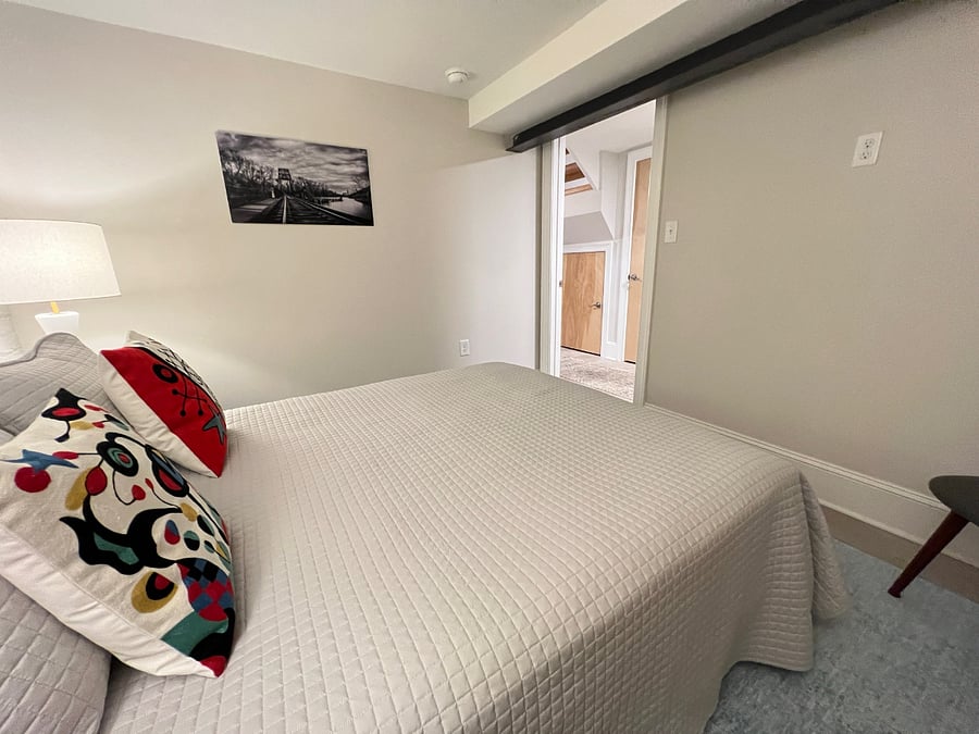Secondary BR with colorful Miro decorative pillows. 