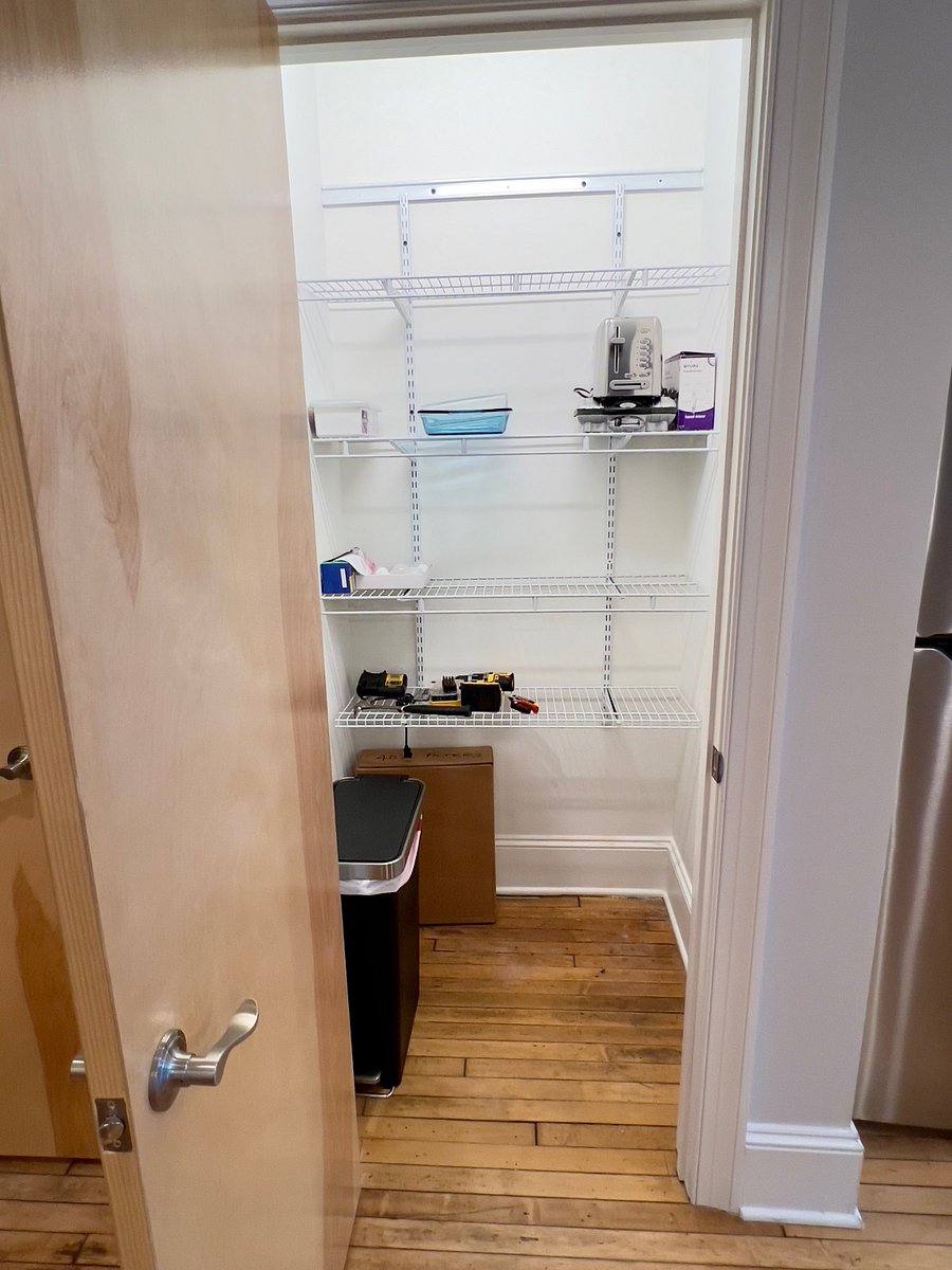 Deep, spacious pantry with great lighting.