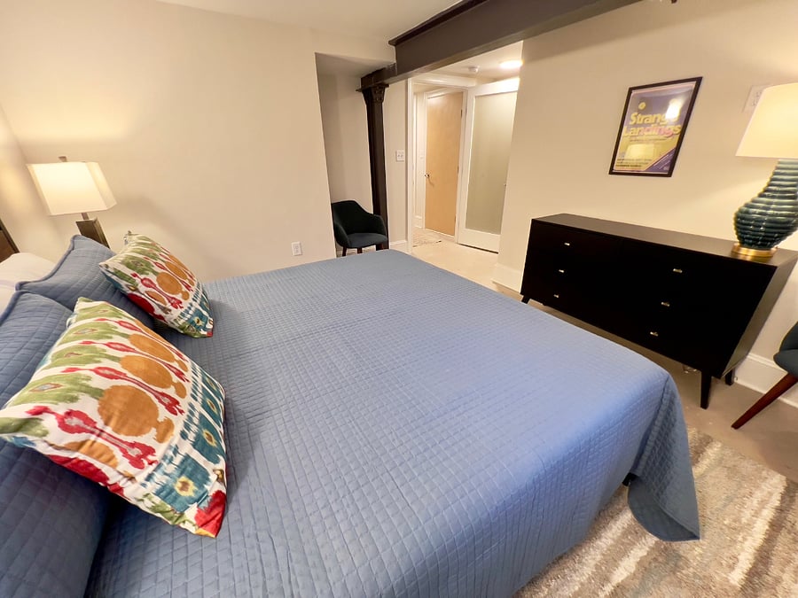 Primary bedroom, view back to entrance. Two sitting chairs in this bedroom.