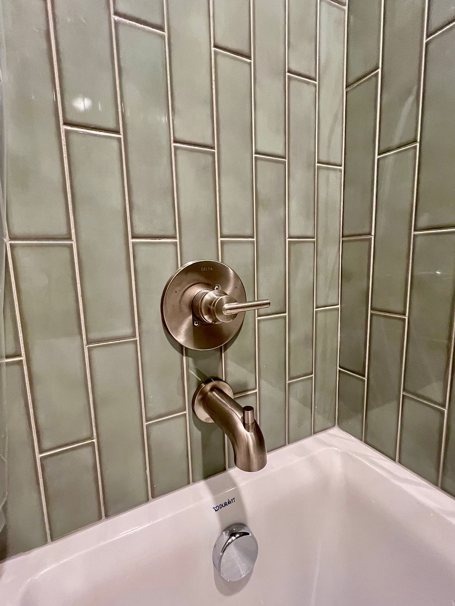 Rich and gorgeous tile work in the tub/shower.