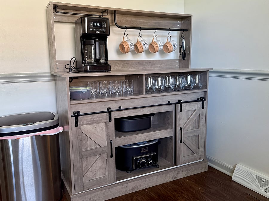 Coffee Bar: Wake up your way - this coffee bar features a 12-cup coffee maker, mugs, rock glasses, stemless wine glasses, wine opener, Ninja slow cooker, and additional storage.