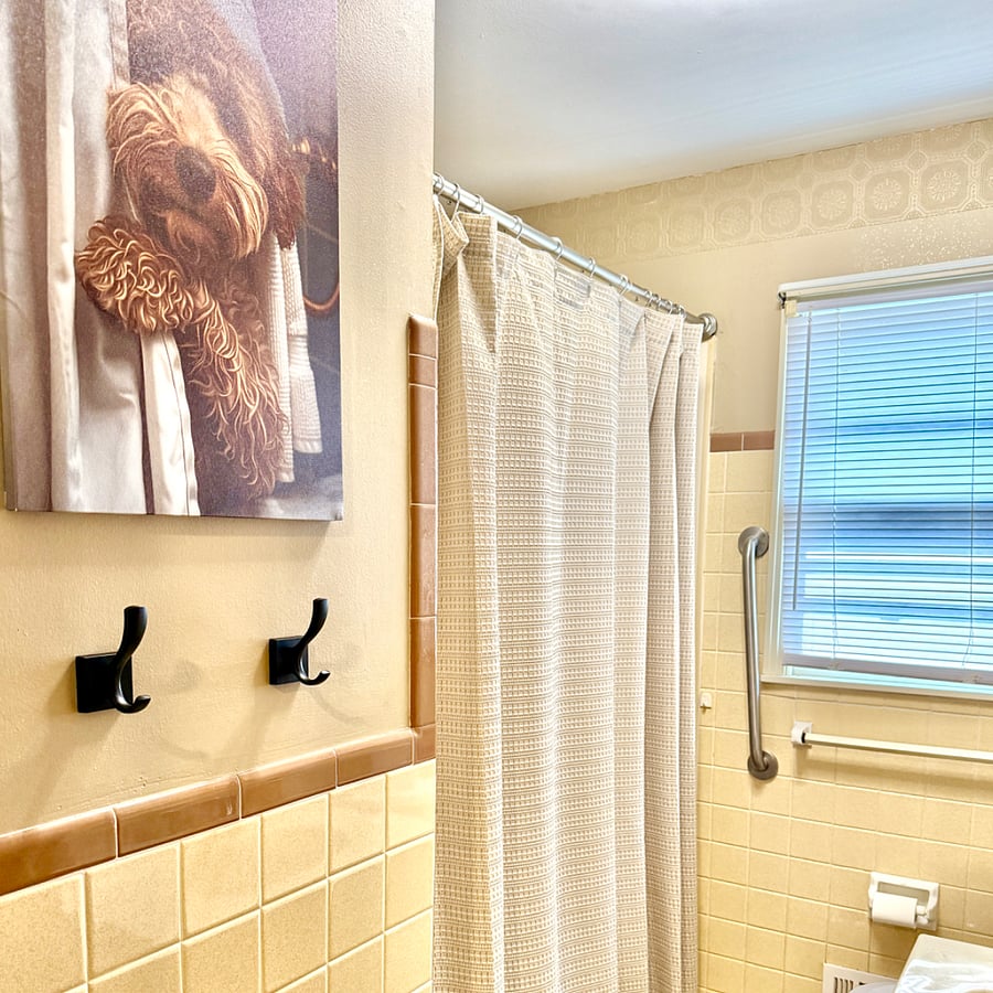 Full bath: A nostalgic and whimsical bathroom featuring a new ceiling exhaust fan with Bluetooth Speaker to enjoy your music during your getting-ready regimen.
