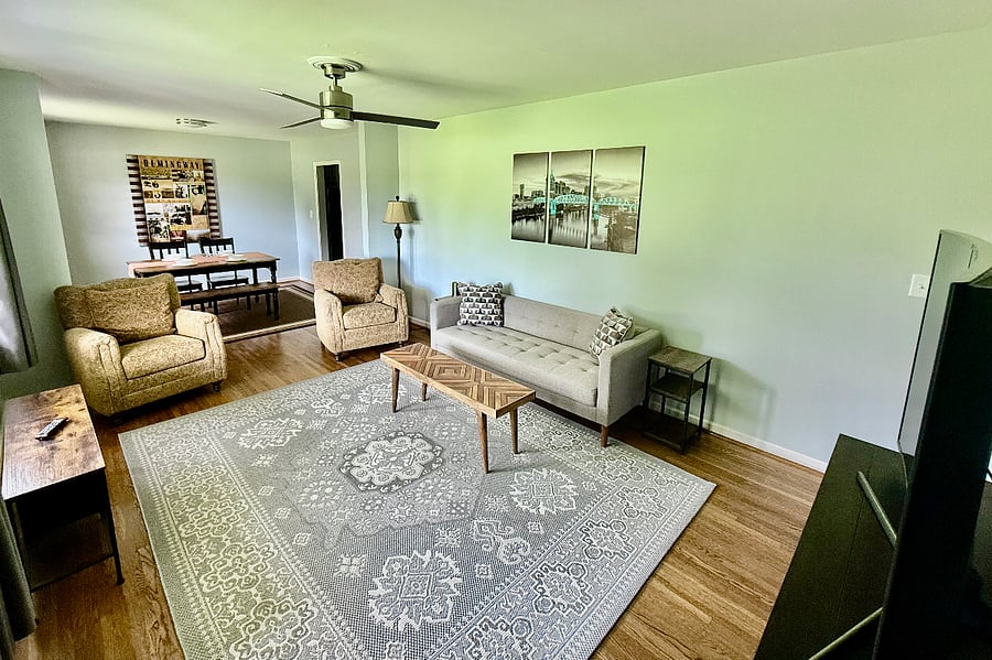 Open dining and living space perfect for a gathering of friends and family when they come to visit. Featuring a 55" Sony Curve TV.