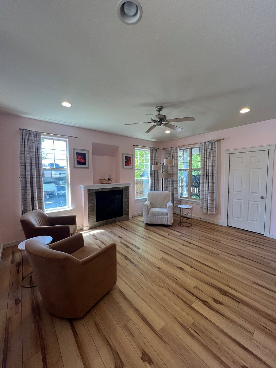 Downstairs sitting area with gas fireplace. Entrance to small back patio