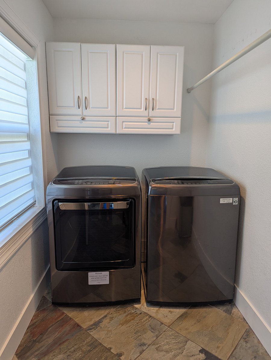 Laundry room with full size LG washer and dryer