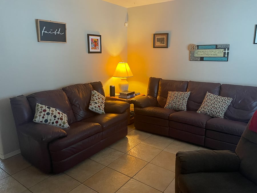 Two leather sofas with reclining end seats. Both end seats on both sofas recline.