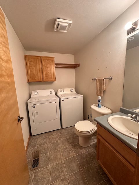 Laundry Room: downstairs for your cleaning needs also equipped with a toilet and sink.