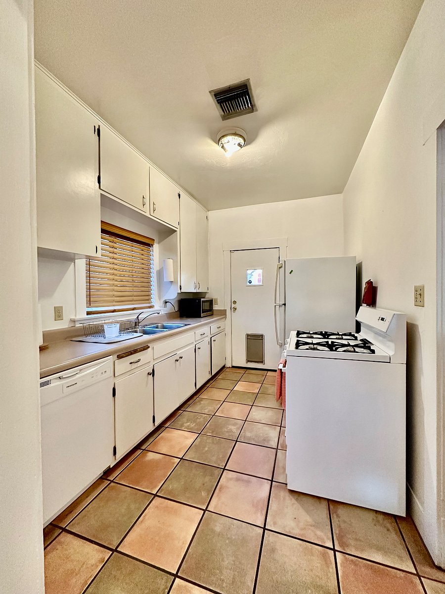 Kitchen with full size fridge, stove/oven, microwave