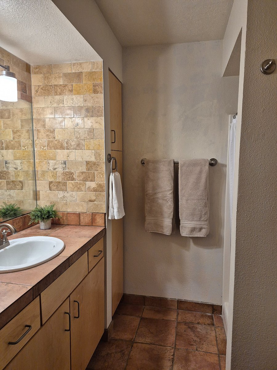 Stone tiled vanity in Master Bathroom