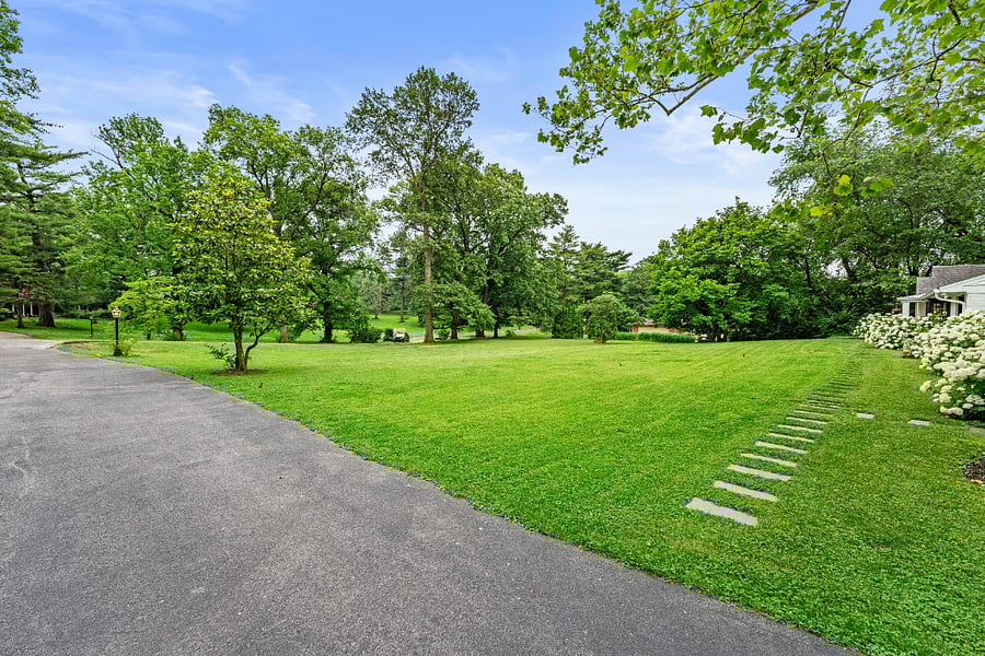 View of front lawn with front walkway stepping stones.