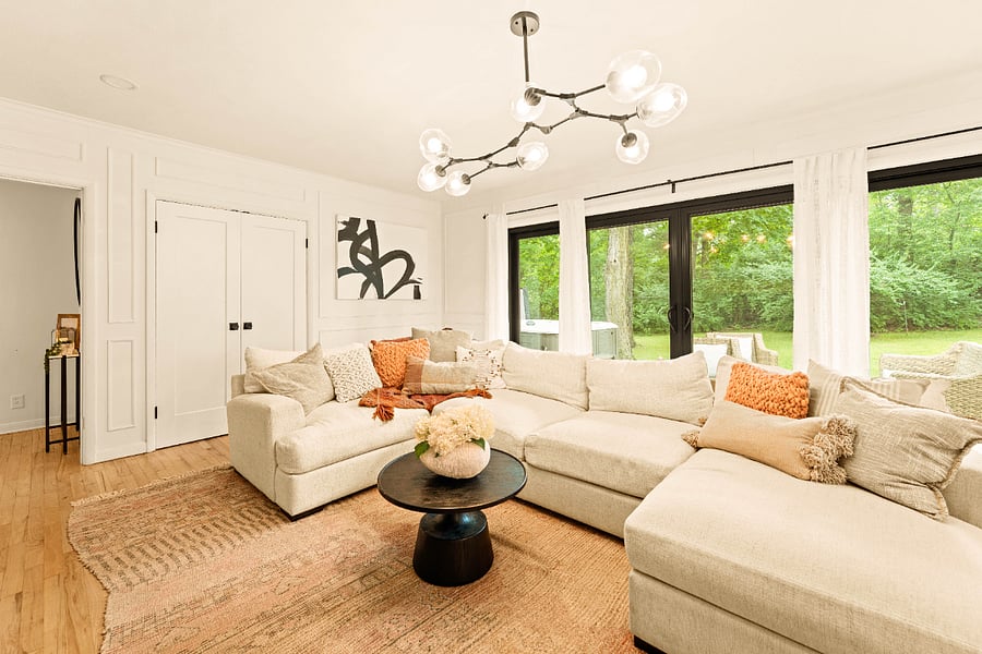 Family room with a very cozy sectional and 12' slider with views of the beautiful backyard.