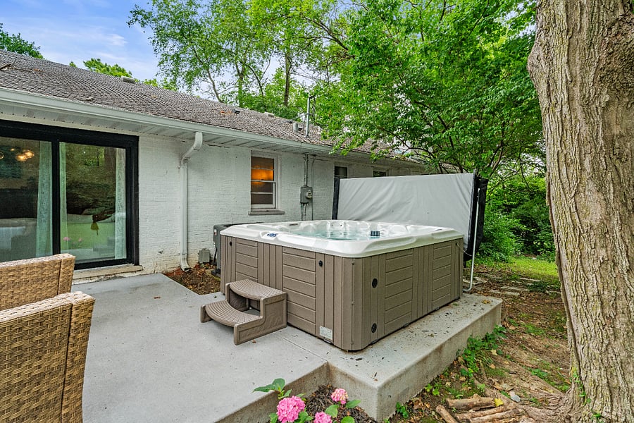 The hot tub is the best place to enjoy the beautiful yard.