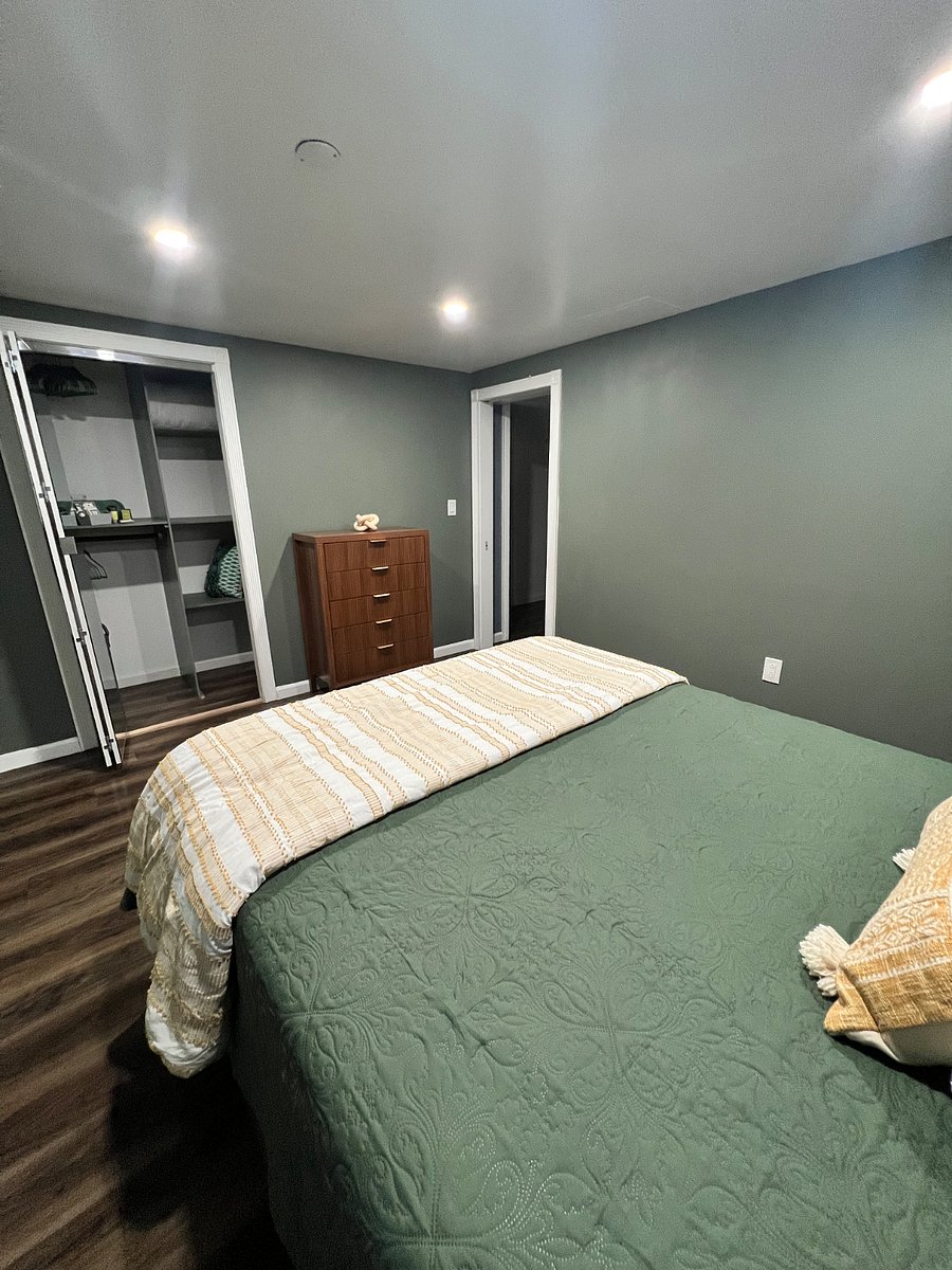 Bedroom One / Closet, dresser, night stand and a folding table to me used as a work station.