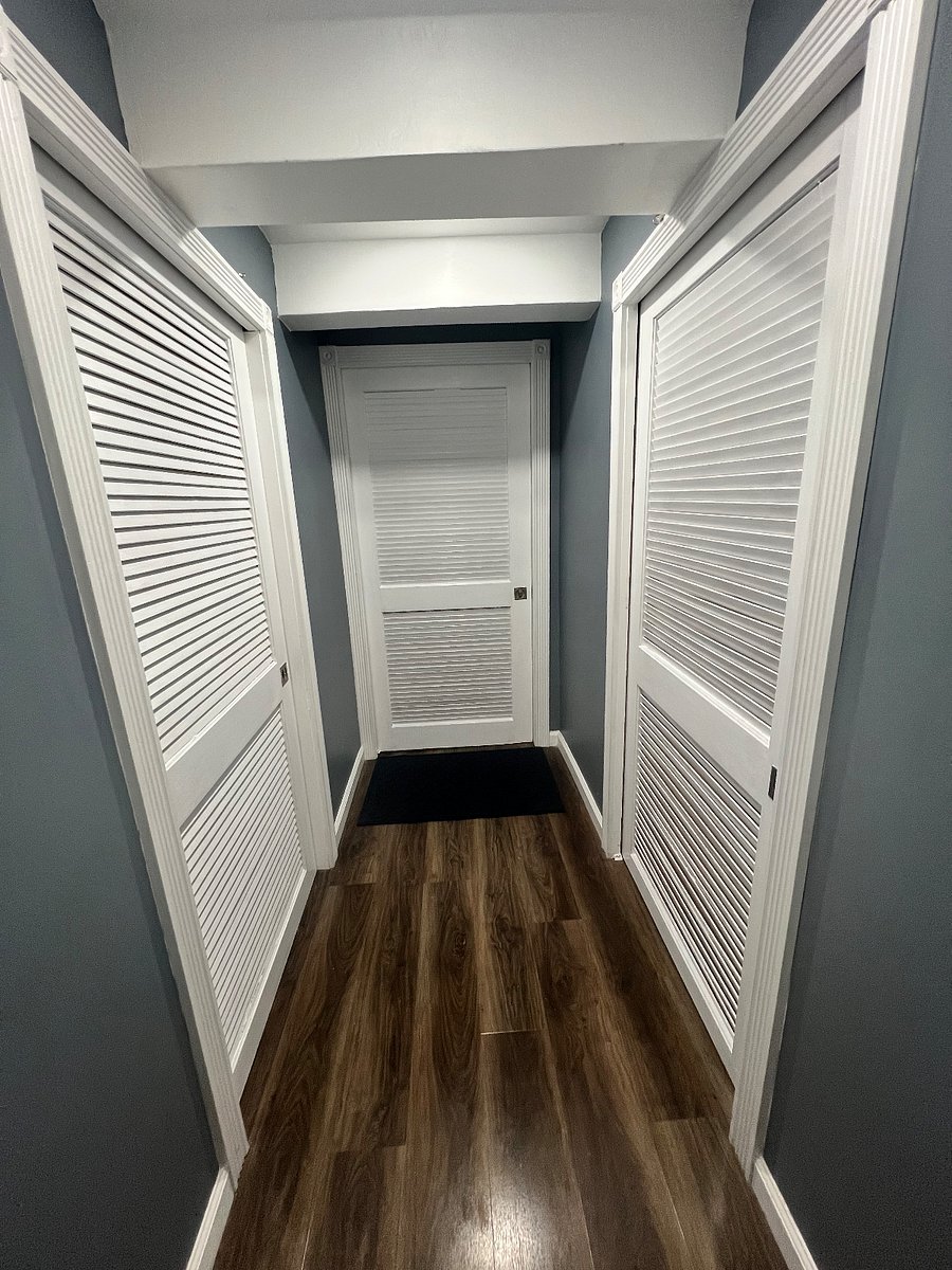 Entrance to Apartment facing door. Door to left washroom access. Door to right owners storage areas.