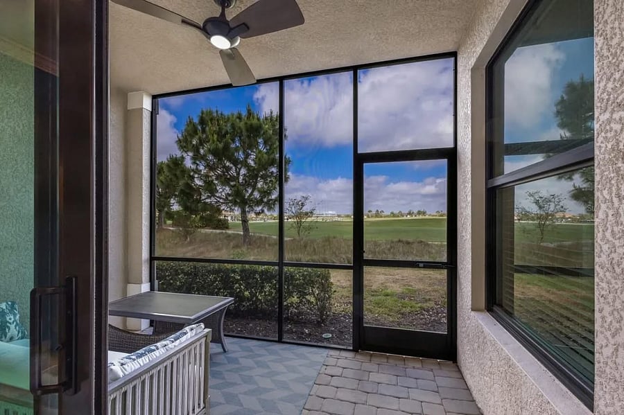The condo has 2 covered lanais (front and back). This view is out the back to the golf course and gets sunsets!