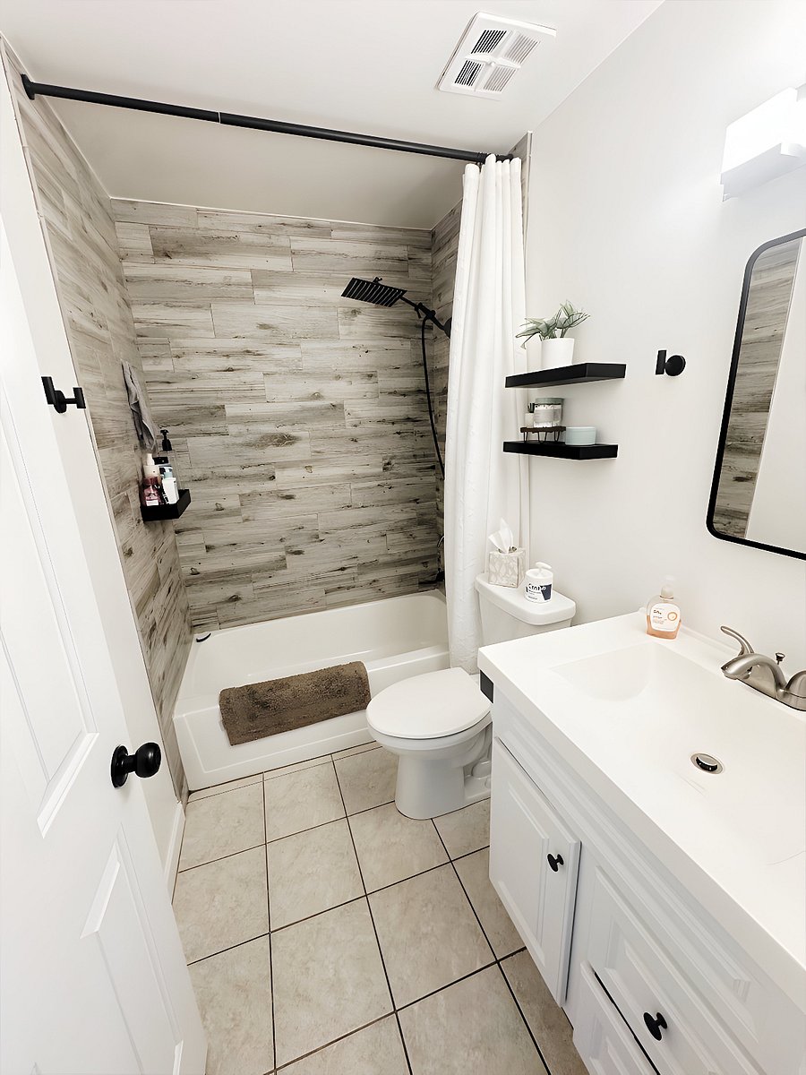 Bathroom featuring rain style shower head
