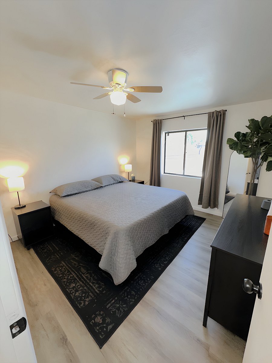 Main bedroom featuring blackout shades, a king bed that will put you right to sleep, and a walk in closet.B