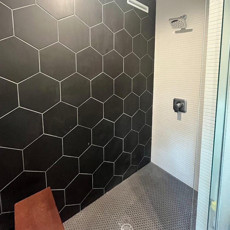 Brand new shower with bench.