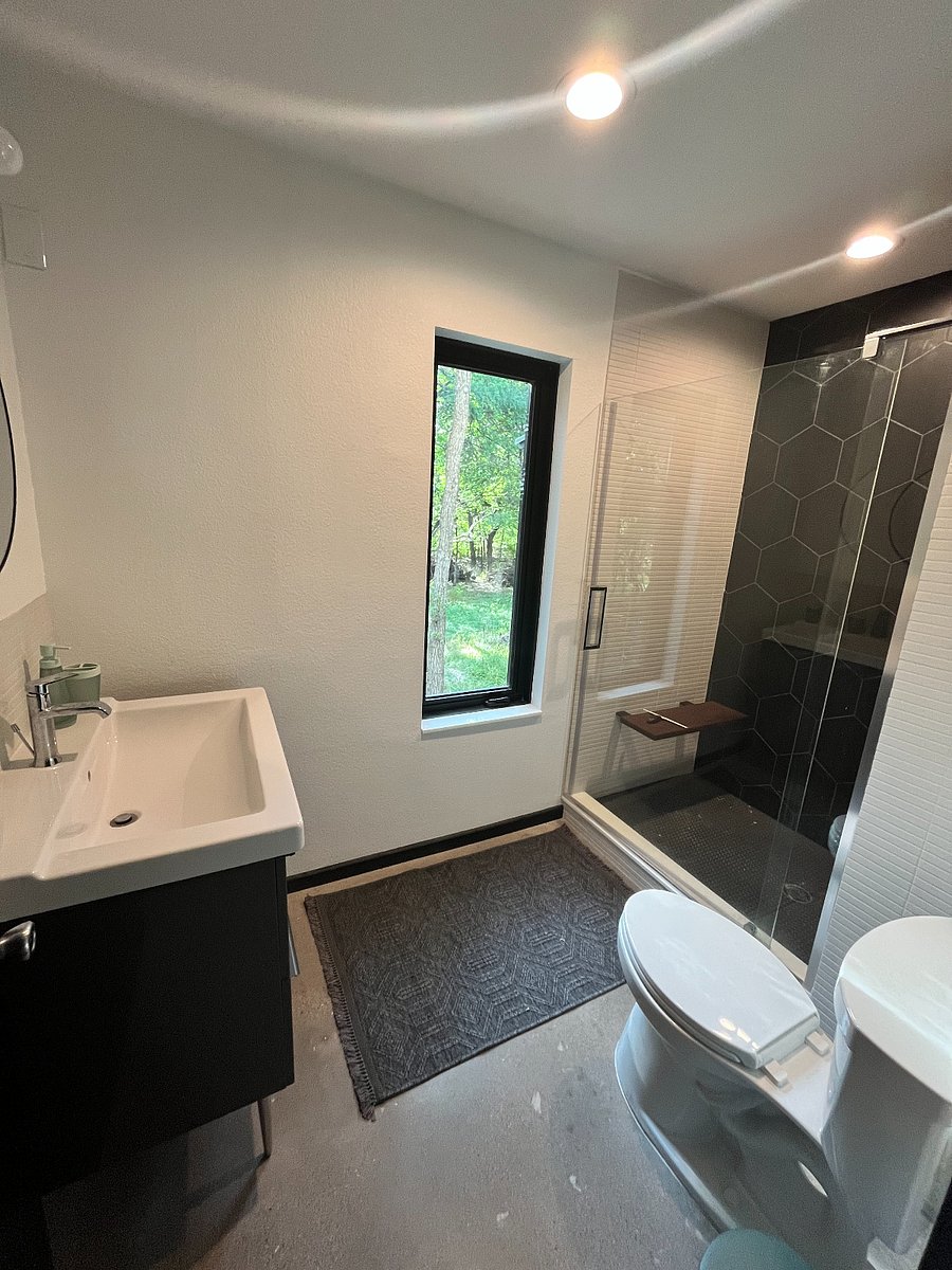 Bathroom cabinet has storage drawers.