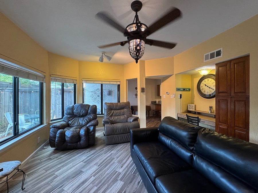 Living room with built-in desk and over-sized recliners and queen sized pull out couch