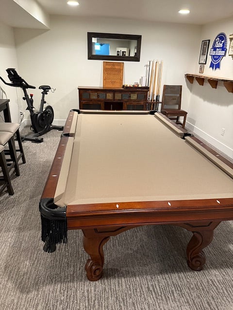 Game room with pool table and Echelon exercise bike 